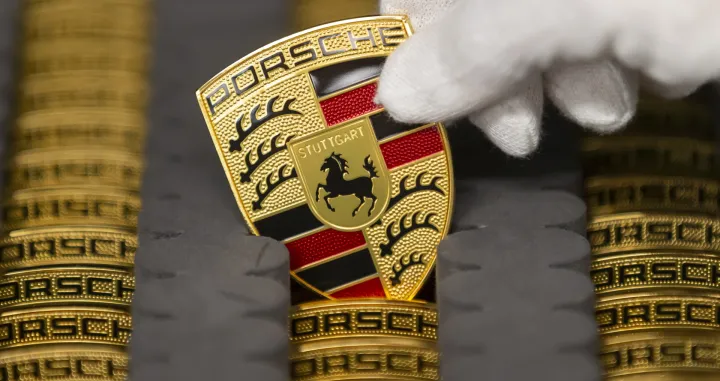 epa08271938 A view of a Logo at the production of Taycan electric sports cars at an assembly line at the German car manufacturer Porsche in Stuttgart, Germany, 05 March 2020. Porsche AG is a listed German manufacturer of luxury sports cars, SUVs and sedans based in Stuttgart. Porsche AG will present the results of the 2020 financial year at the annual press conference on 24 March 2020. EPA/RONALD WITTEK/Ronald Wittek