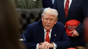 U.S. President Donald Trump sits behind a bill he signed to end the partial government shutdown, at the White House in Washington, D.C., U.S., February 3, 2026. REUTERS/Evelyn Hockstein/Evelyn Hockstein