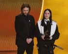 Billie Eilish accepts the award for Song of the Year for "WILDFLOWER" as Finneas looks on during the 68th Annual Grammy Awards in Los Angeles, California, U.S., February 1, 2026. REUTERS/Daniel Cole/Daniel Cole