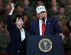 FILE PHOTO: U.S. President Donald Trump speaks as Japanese Prime Minister Sanae Takaichi gestures towards military personnel, aboard the aircraft carrier USS George Washington, during their visit to the U.S. Navy's Yokosuka base in Yokosuka, Japan, October 28, 2025. REUTERS/Kim Kyung-Hoon/File Photo/Kim Kyung-hoon