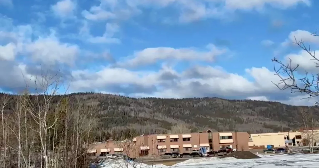 Vehicles are parked outside the Tumbler Ridge Secondary School, the site of a deadly mass shooting in Tumbler Ridge, British Columbia, Canada, February 10, 2026, in this screengrab obtained from a social media video. Trent Ernst/Tumbler RidgeLines/via REUTERS THIS IMAGE HAS BEEN SUPPLIED BY A THIRD PARTY. MANDATORY CREDIT. NO RESALES. NO ARCHIVES.  TPX IMAGES OF THE DAY  VERIFICATION: Reuters was able to confirm the location of the video as the middle school, roadmap layout and residential buildings matched with file and satellite images. Reuters was able to confirm the date of the video as they were livestreamed. Local police confirmed ten people are dead including the shooter at a high school in Tumbler Ridge on Tuesday (February 10)/Trent Ernst/tumbler Ridgelines