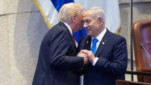 FILE PHOTO: President Donald Trump talks with Israel's Prime Minister Benjamin Netanyahu at the Knesset, Monday, Oct. 13, 2025, in Jerusalem.  Evan Vucci/Pool via REUTERS/File Photo/Evan Vucci