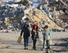 FILE PHOTO: Palestinian girls walk past the rubble of residential buildings destroyed during the war, in Gaza City, January 16, 2026. REUTERS/Dawoud Abu Alkas/File Photo/Dawoud Abu Alkas