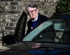 FILE PHOTO: Former British Ambassador to the U.S. Peter Mandelson enters a vehicle outside a reported residence, after police launched a misconduct in public office investigation following the release of U.S. Justice Department files linked to the late financier and convicted sex offender Jeffrey Epstein, in London, Britain, February 14, 2026. REUTERS/Chris Ratcliffe/Chris J Ratcliffe