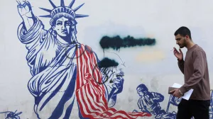 A man walks past a mural depicting a damaged Statue of Liberty, on a street in Tehran, Iran, February 26, 2026. Majid Asgaripour/WANA (West Asia News Agency) via REUTERS ATTENTION EDITORS - THIS PICTURE WAS PROVIDED BY A THIRD PARTY  TPX IMAGES OF THE DAY/Majid Asgaripour