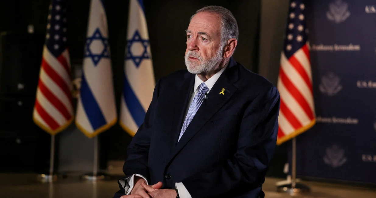 FILE PHOTO: U.S. Ambassador to Israel Mike Huckabee looks on during an interview with Reuters in Jerusalem, September 10, 2025. REUTERS/Ronen Zvulun/File Photo/Ronen Zvulun
