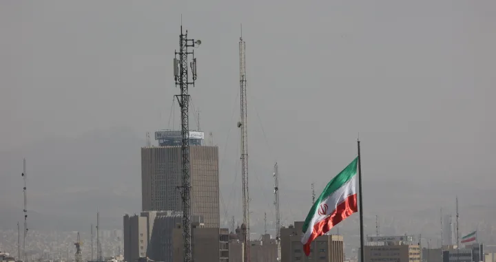 An Iranian flag flutters, as Israel and the U.S. launched strikes on Iran, in Tehran, Iran, February 28, 2026. Majid Asgaripour/WANA (West Asia News Agency) via REUTERS ATTENTION EDITORS - THIS PICTURE WAS PROVIDED BY A THIRD PARTY/Majid Asgaripour