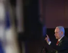Israeli Prime Minister Benjamin Netanyahu gestures as he speaks during the Conference of Presidents of Major American Jewish Organisations, in Jerusalem, February 15, 2026. REUTERS/Ronen Zvulun/Ronen Zvulun