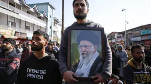 A Shiite Muslim man holds a photo of Iran's Supreme Leader Ayatollah Ali Khamenei, as they protest after Khamenei was killed in Israeli-U.S. strikes on Saturday, in Srinagar, Indian Kashmir March 1, 2026. REUTERS/Sharafat Ali/Sharafat Ali