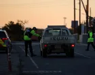 Police check vehicles on the road leading to RAF Akrotiri, a British sovereign base in Cyprus, which was hit by an unmanned drone overnight, causing limited damage, Cyprus March 2, 2026. REUTERS/Yiannis Kourtoglou/Yiannis Kourtoglou