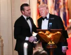 U.S. Secretary of Defense Pete Hegseth and U.S. President Donald Trump shake hands during a Governors Dinner at the White House in Washington D.C., U.S., February 21, 2026. REUTERS/Aaron Schwartz/Aaron Schwartz
