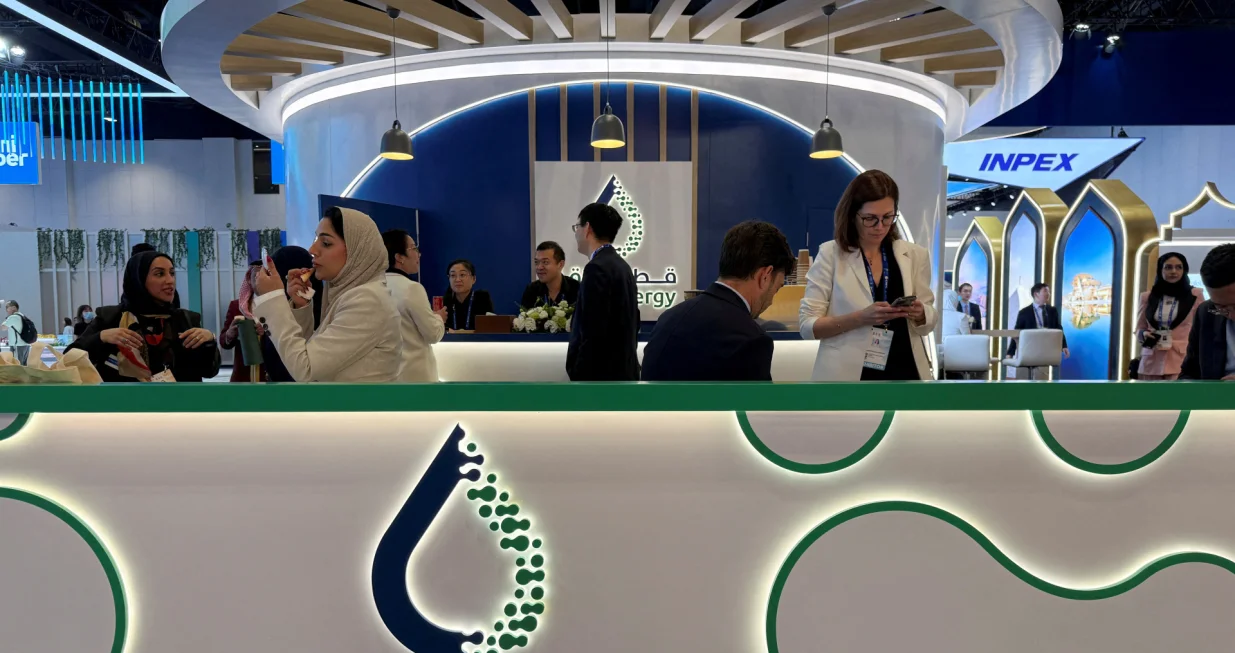 FILE PHOTO: People visit the QatarEnergy booth at the World Gas Conference exhibition in Beijing, China May 21, 2025. REUTERS/Liz Lee/File Photo/Liz Lee