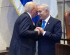 FILE PHOTO: President Donald Trump talks with Israel's Prime Minister Benjamin Netanyahu at the Knesset, Monday, Oct. 13, 2025, in Jerusalem.  Evan Vucci/Pool via REUTERS/File Photo/Evan Vucci