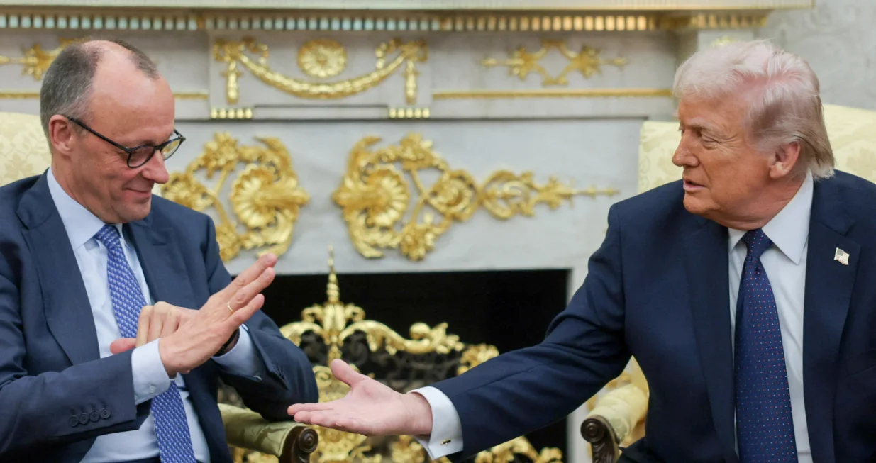 U.S. President Donald Trump and German Chancellor Friedrich Merz reach to shake hands as they meet in the Oval Office at the White House in Washington, D.C., U.S., March 3, 2026. REUTERS/Jonathan Ernst  TPX IMAGES OF THE DAY/Jonathan Ernst