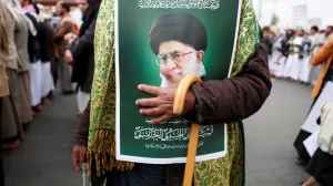 A man holding a poster featuring a picture of late Iran's Supreme Leader Ayatollah Ali Khamenei joins a demonstration with Houthi supporters in solidarity with Iran and Lebanon, amid the U.S.-Israeli conflict with Iran, in Sanaa, Yemen March 6, 2026. REUTERS/Khaled Abdullah/Khaled Abdullah