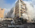 Smoke rises from a building damaged during strikes, following an escalation between Hezbollah and Israel, amid the U.S.-Israeli conflict with Iran, in Beirut, Lebanon March 4, 2026, in this screengrab obtained from a social media video. Obtained By Reuters/via REUTERS THIS IMAGE HAS BEEN SUPPLIED BY A THIRD PARTY. VERIFICATION: -Location verified from building layout, roof shape and windows, which matched satellite imagery -Date verified by original file metadata/Obtained By Reuters
