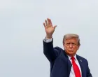 FILE PHOTO: U.S. President Donald Trump waves as he boards Air Force One upon departure following his meeting with Russian President Vladimir Putin to negotiate an end to the war in Ukraine, at Joint Base Elmendorf-Richardson, Alaska, U.S., August 15, 2025. REUTERS/Kevin Lamarque/File Photo/Kevin Lamarque