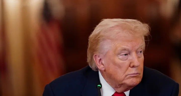 U.S. President Donald Trump looks on during a round table on collegiate sports in the White House in Washington, D.C., March 6, 2026. REUTERS/Nathan Howard/Nathan Howard