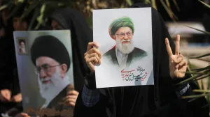 FILE PHOTO: A woman gestures while holding an image of Iran's late Supreme Leader Ayatollah Ali Khamenei, on the day of an anti-Israeli and U.S. rally, amid the U.S.-Israeli conflict with Iran, in Tehran, Iran, March 6, 2026. Majid Asgaripour/WANA (West Asia News Agency) via REUTERS ATTENTION EDITORS - THIS PICTURE WAS PROVIDED BY A THIRD PARTY/File Photo/Majid Asgaripour