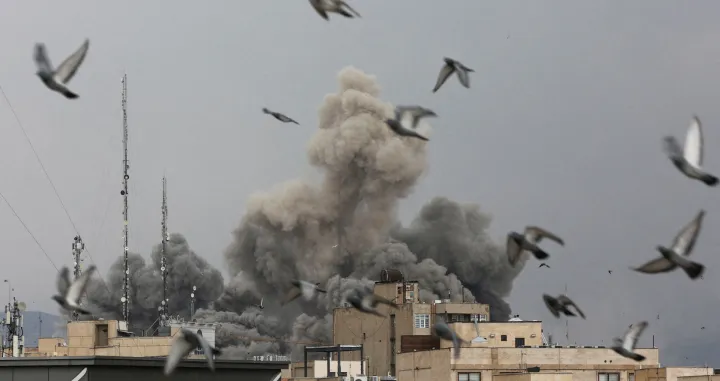 FILE PHOTO: Birds fly as smoke rises following an explosion, after Israel and the U.S. launched strikes on Iran, amid the U.S.-Israel conflict with Iran, in Tehran, Iran, March 2, 2026. WANA (West Asia News Agency) via REUTERS/File Photo ATTENTION EDITORS - THIS PICTURE WAS PROVIDED BY A THIRD PARTY/Wana News Agency