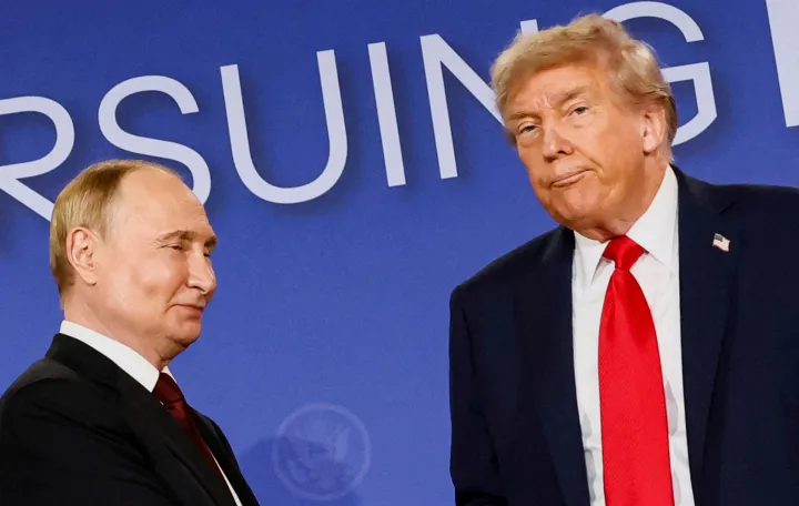 FILE PHOTO: U.S. President Donald Trump looks on next to Russian President Vladimir Putin during a press conference following their meeting to negotiate an end to the war in Ukraine, at Joint Base Elmendorf-Richardson, in Anchorage, Alaska, U.S., August 15, 2025. REUTERS/Kevin Lamarque  TPX IMAGES OF THE DAY/File Photo/Kevin Lamarque