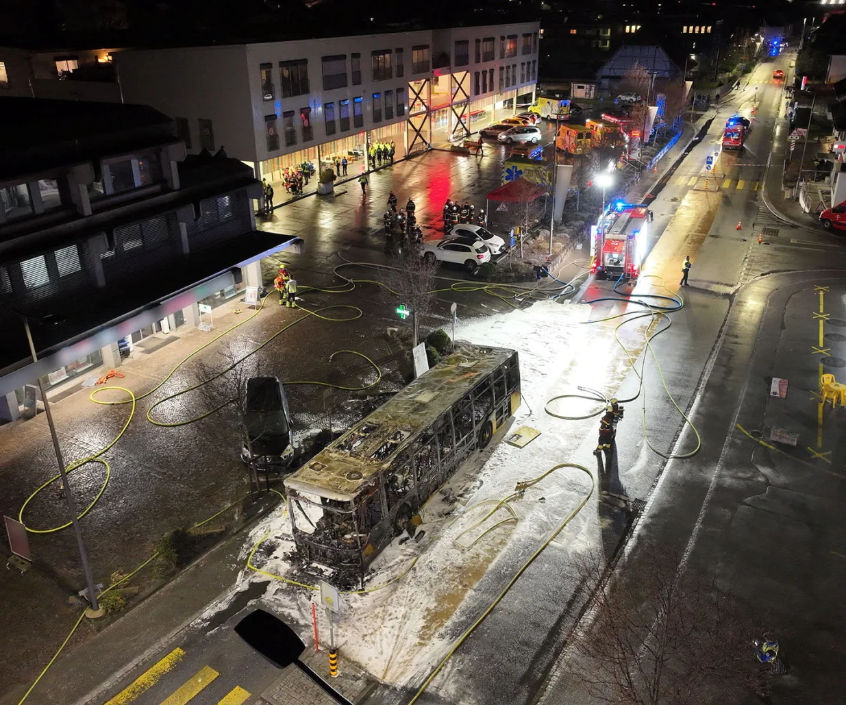 Emergency personnel work at the site of a deadly bus fire in Kerzers, Switzerland, March 10, 2026. STATE OF FREIBURG/Handout via REUTERS THIS IMAGE HAS BEEN SUPPLIED BY A THIRD PARTY. NO RESALES. NO ARCHIVES. MANDATORY CREDIT. SELECTIVE BLURRING FROM SOURCE./State Of Freiburg