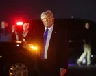 U.S. President Donald Trump gestures after disembarking Air Force One at Palm Beach International Airport in West Palm Beach, Florida, U.S., March 13, 2026. REUTERS/Kevin Lamarque/Kevin Lamarque