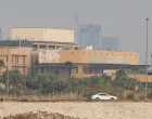 A car moves past the U.S. Embassy, after Iraqi security sources said the embassy was hit in a missile attack, in Baghdad, Iraq, March 14, 2026,. REUTERS/Ahmed Saad/Ahmed Saad