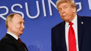 FILE PHOTO: U.S. President Donald Trump looks on next to Russian President Vladimir Putin during a press conference following their meeting to negotiate an end to the war in Ukraine, at Joint Base Elmendorf-Richardson, in Anchorage, Alaska, U.S., August 15, 2025. REUTERS/Kevin Lamarque  TPX IMAGES OF THE DAY/File Photo/Kevin Lamarque
