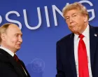 FILE PHOTO: U.S. President Donald Trump looks on next to Russian President Vladimir Putin during a press conference following their meeting to negotiate an end to the war in Ukraine, at Joint Base Elmendorf-Richardson, in Anchorage, Alaska, U.S., August 15, 2025. REUTERS/Kevin Lamarque  TPX IMAGES OF THE DAY/File Photo/Kevin Lamarque