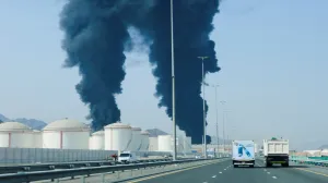 Smoke rises in the Fujairah oil industry zone, caused by debris after interception of a drone by air defenses, according to the Fujairah media office, amid the U.S.-Israel conflict with Iran, in Fujairah, United Arab Emirates, March 14, 2026. REUTERS/Staff/Staff