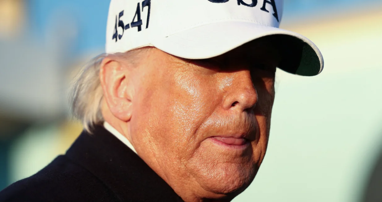 U.S. President Donald Trump looks on before boarding Air Force One for travel to Florida, at Joint Base Andrews, Maryland, U.S., March 13, 2026. REUTERS/Kevin Lamarque/Kevin Lamarque