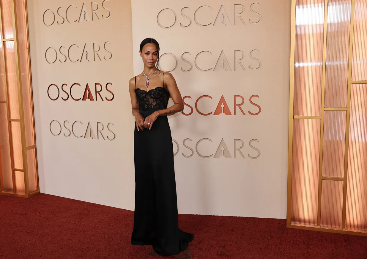 Zoe Saldana poses on the red carpet during the Oscars arrivals at the 98th Academy Awards in Hollywood, Los Angeles, California, U.S., March 15, 2026. REUTERS/Daniel Cole/Daniel Cole
