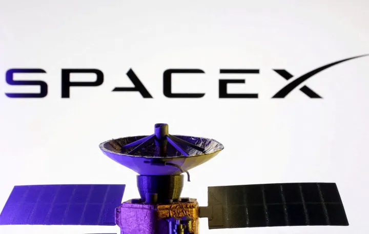 FILE PHOTO: SpaceX logo and miniature satellite model are seen in this illustration created on March 10, 2025. REUTERS/Dado Ruvic/Illustration/File Photo/File Photo/Dado Ruvic