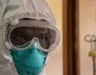 epa10255232 A Ugandan doctor dressing in his Personal Protective Equipments at the Entebbe Regional Referral Hospital Isolation Centre in Entebbe, Uganda, 20 october 2022. A total of 64 positive cases and 24 deaths have so far been confirmed in Uganda since the outbreak of the deadly Ebola virus a month ago in Uganda. EPA/ISAAC KASAMANI/Isaac Kasamani